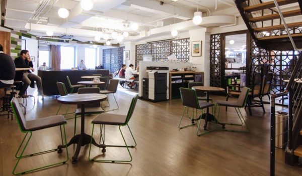 WeWork, open space with cafe tables