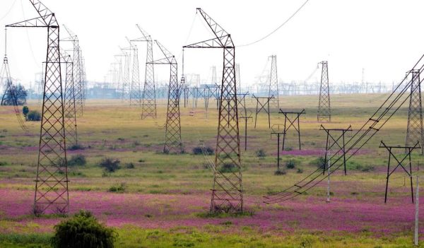 High voltage power lines running through the Rietvlei Nature Reserve in Pretoria, South Africa.
